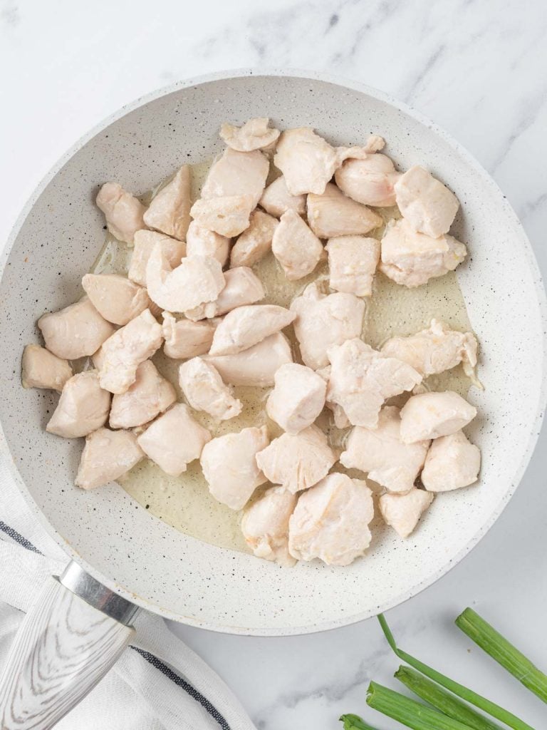 sautéed cubed chicken in a skillet