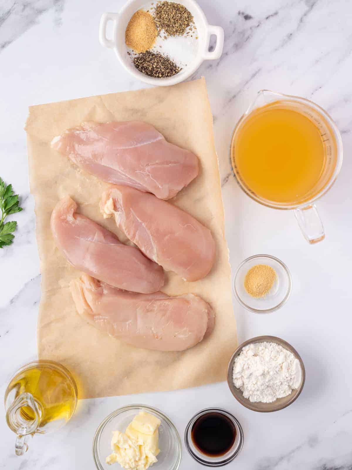 Chicken breasts, broth, flour, butter, oil and seasonings for the dish.