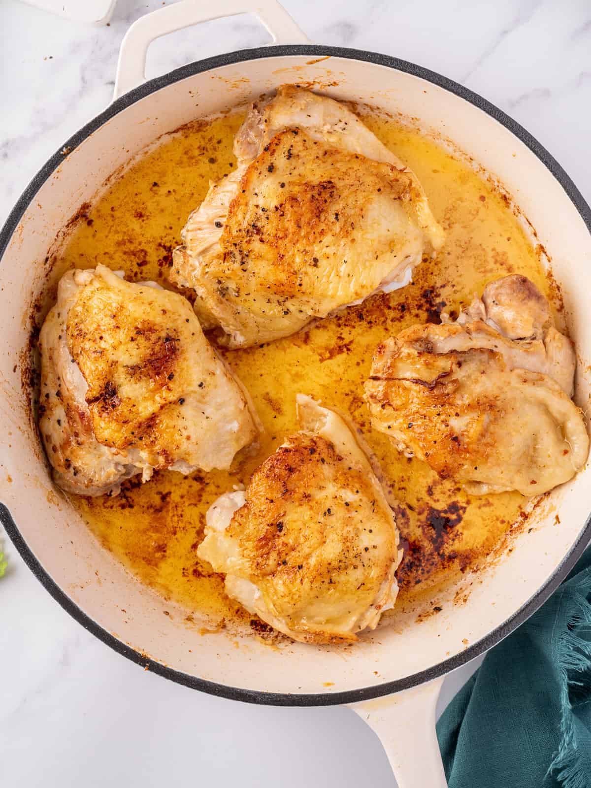 Chicken browning in a skillet.