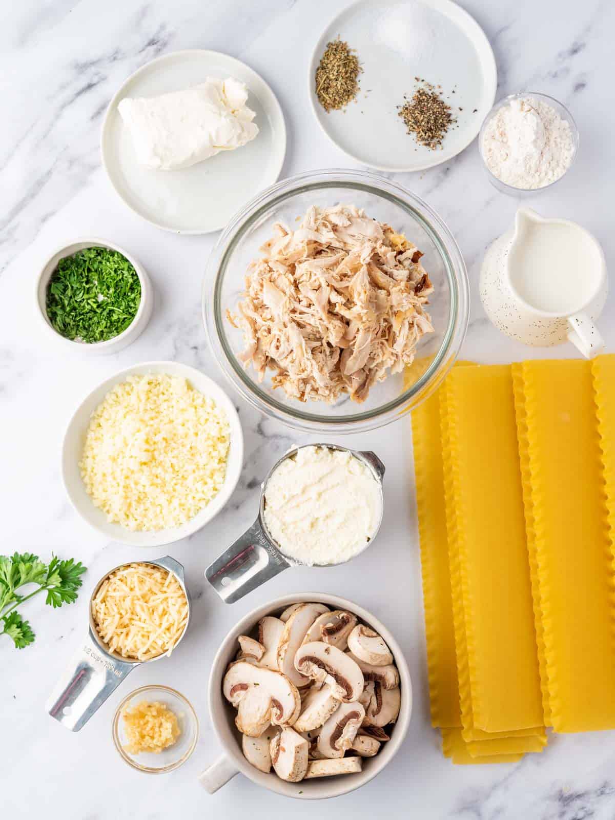 Bowls of ingredients needed for Chicken Alfredo Lasagna Roll Ups.