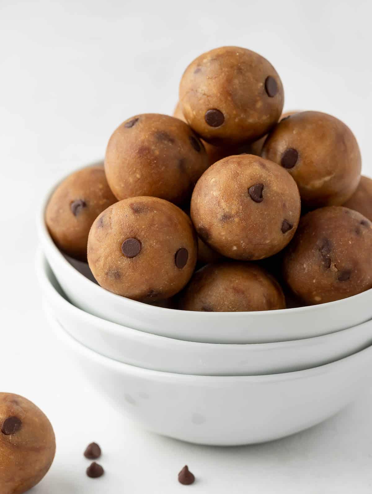 close up side shot of the protein balls in a white bowl