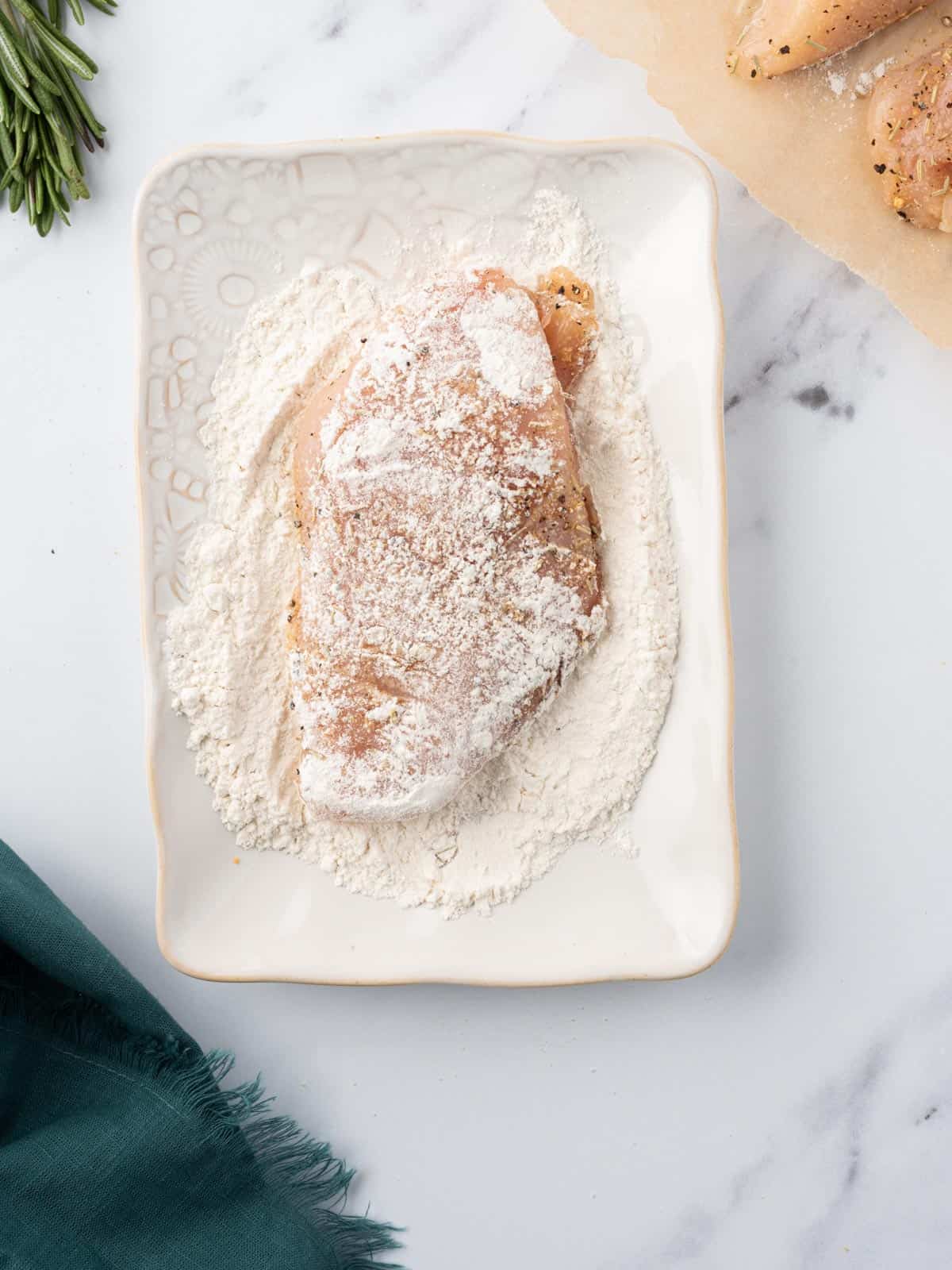 Chicken dredged in flour.