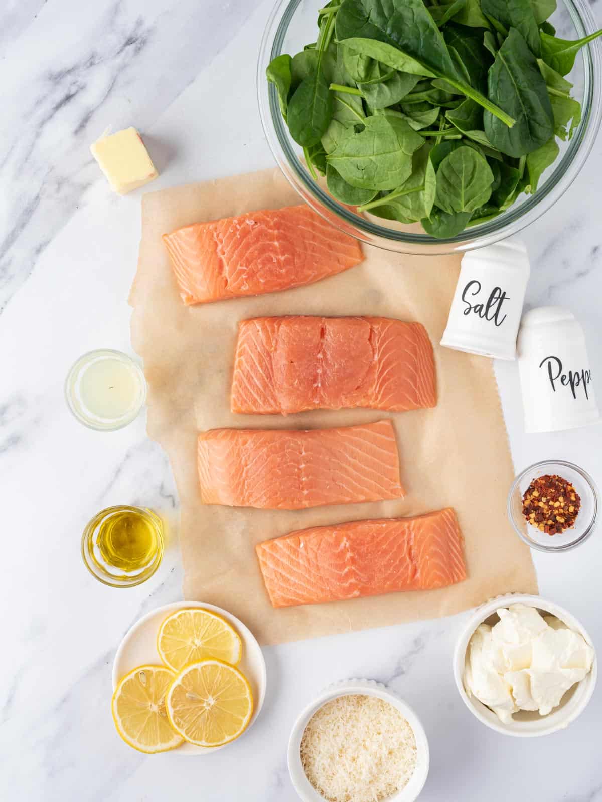 Ingredients needed to make creamy stuffed spinach salmon.
