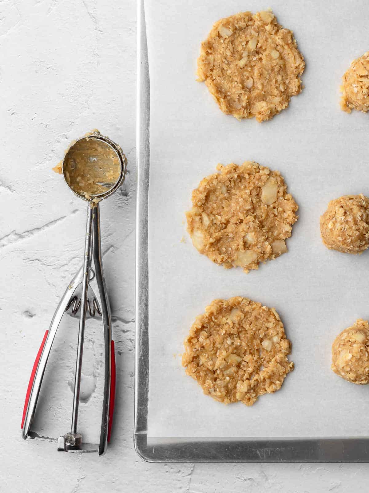 crispy almond cookie on a sheet pan before baking