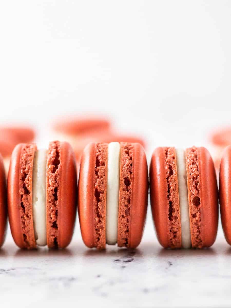 3 french red velvet macaron laid next to each other
