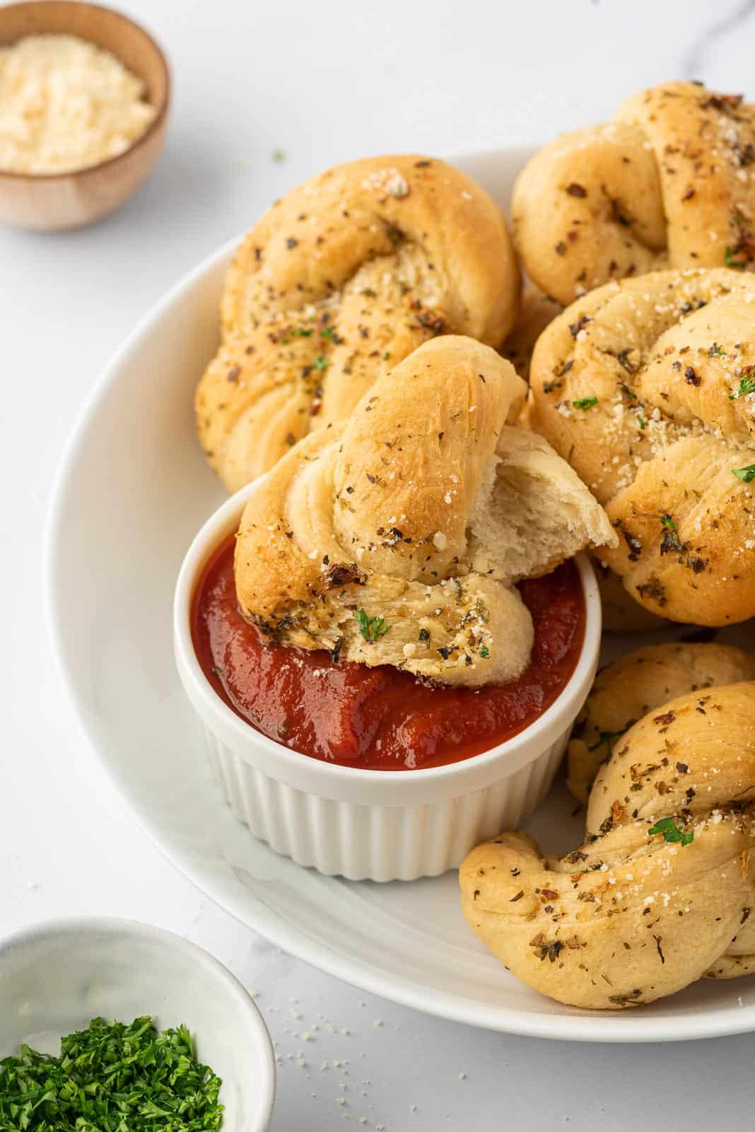 garlic knot bread dipped in marinara sauce