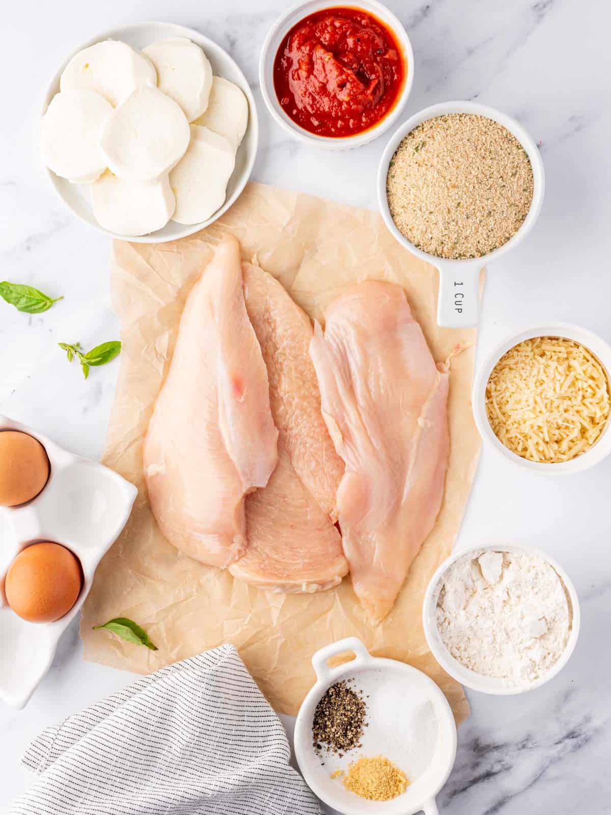 Ingredients needed for easy baked chicken parm.