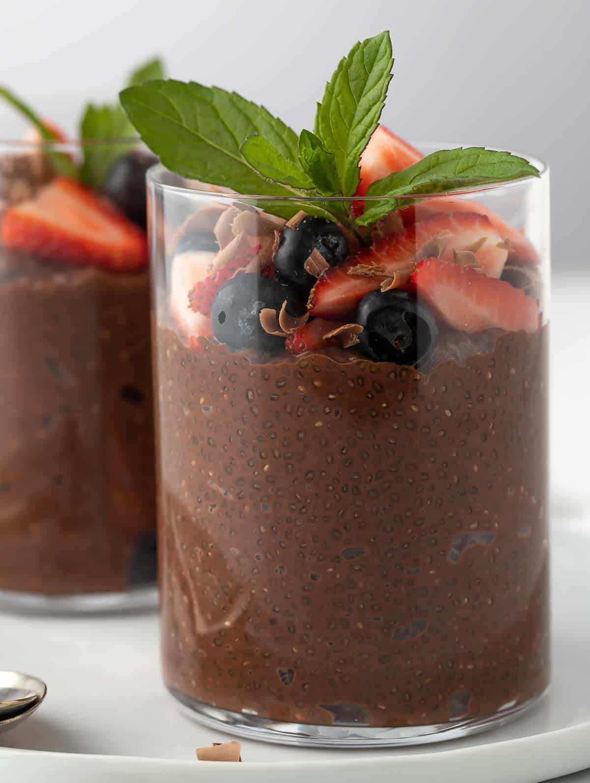 close up shot of the chia chocolate pudding topped with fruits