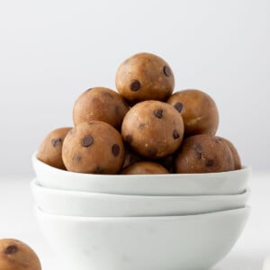 Protein cookie dough balls in a white bowl