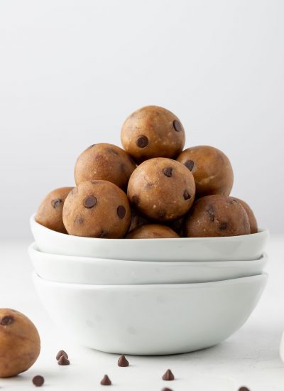 Protein cookie dough balls in a white bowl