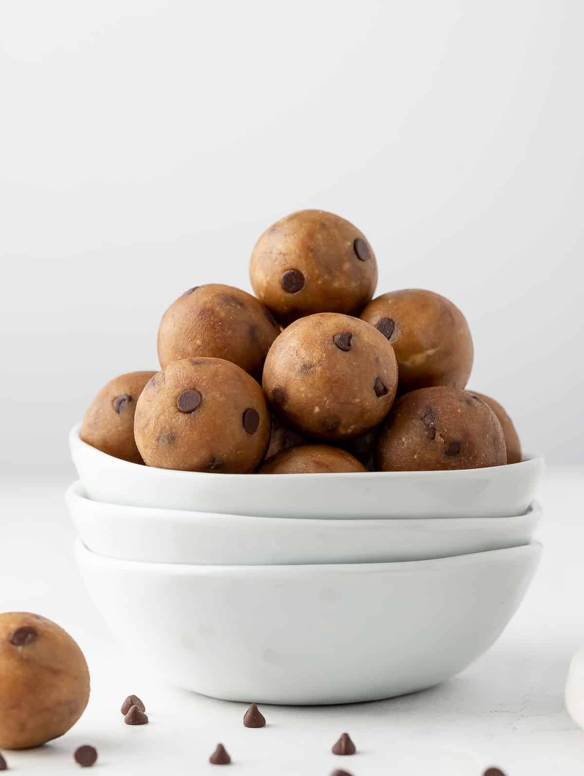 Protein cookie dough balls in a white bowl