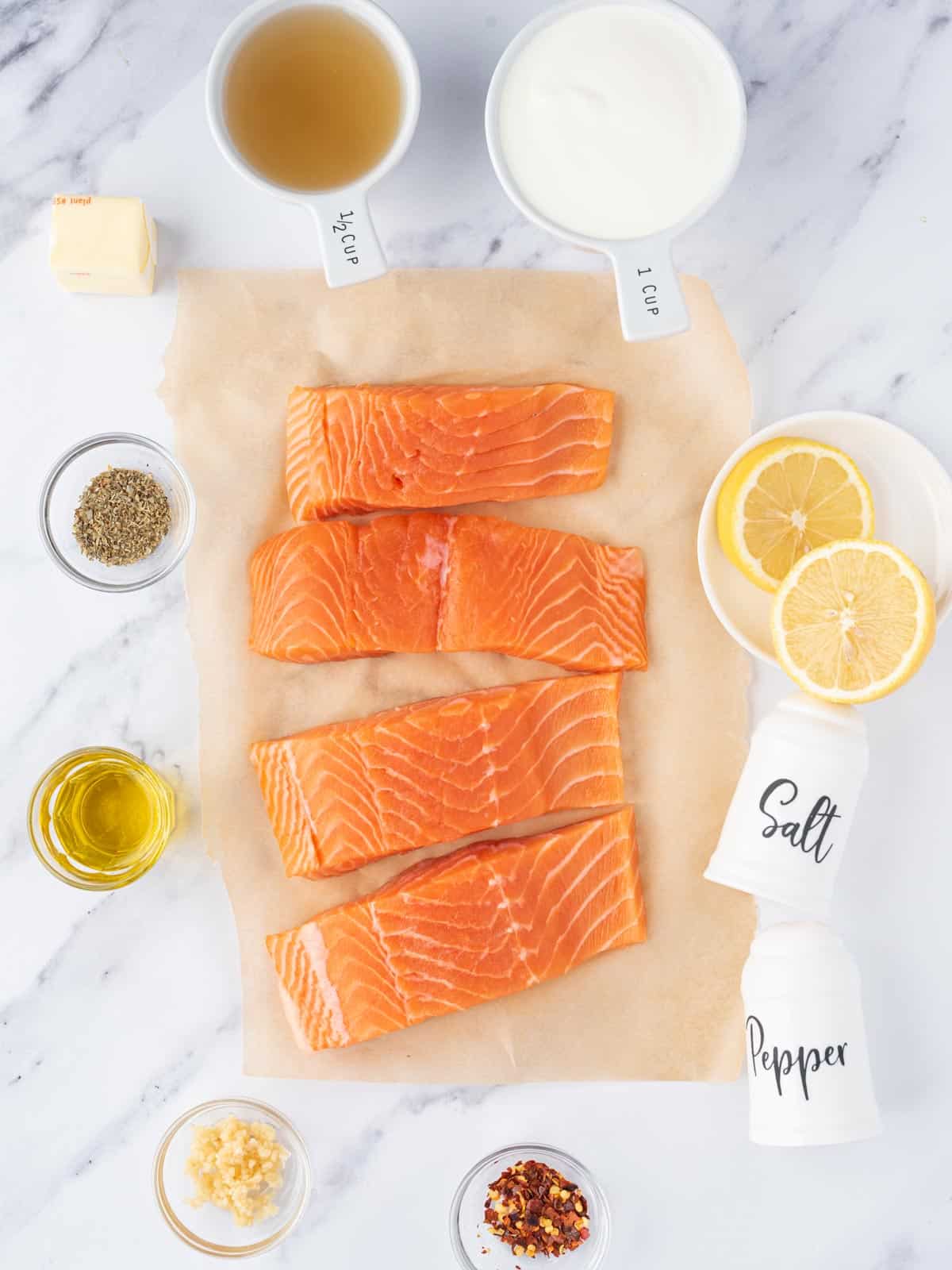 Ingredients needed to make creamy lemon butter salmon.