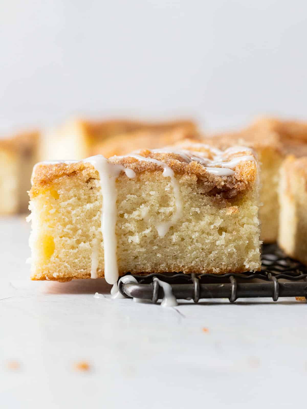 piece of Cinnamon Streusel Cake on a cooling rack