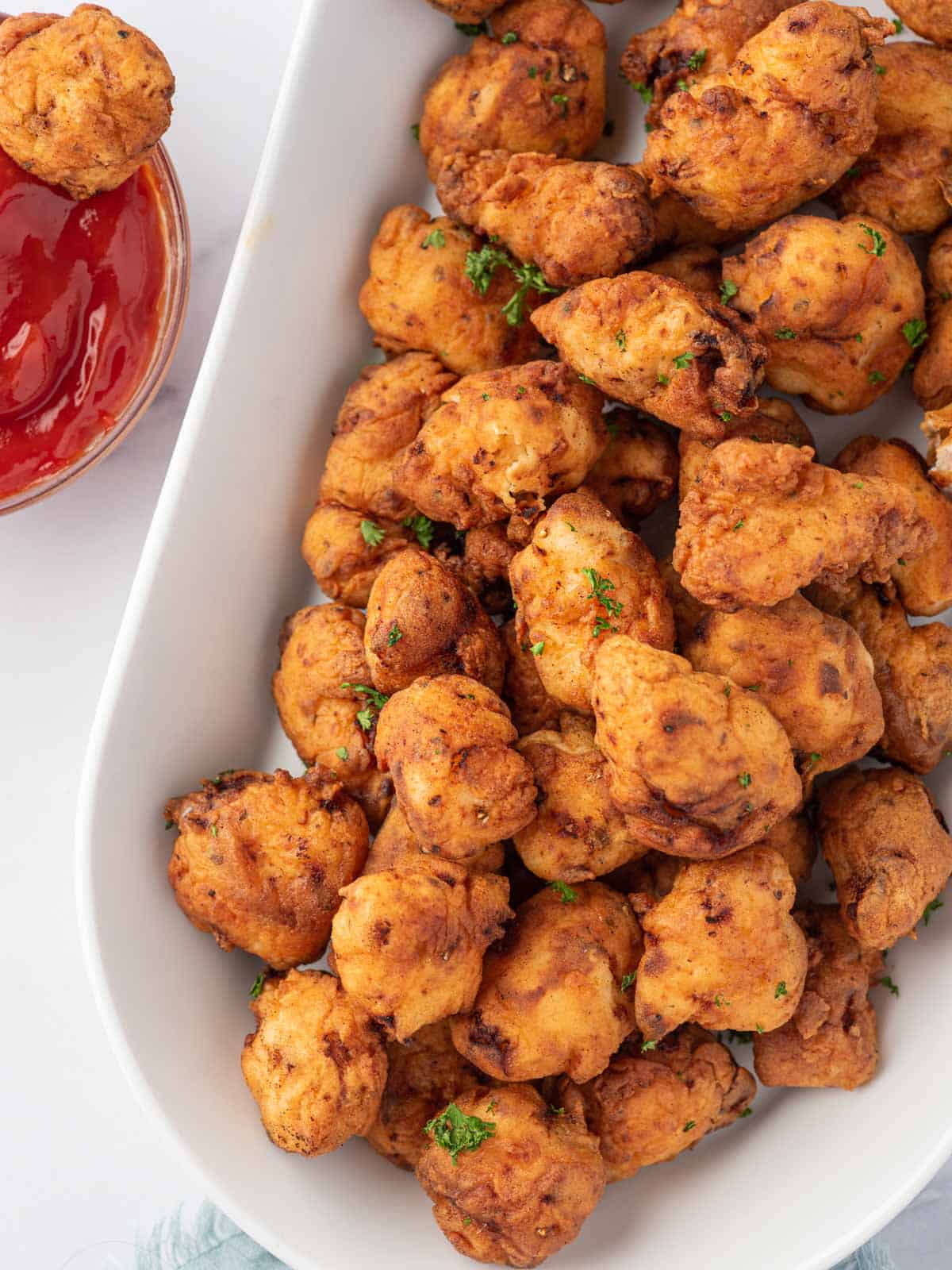 Easy popcorn chicken recipe on a platter for serving.