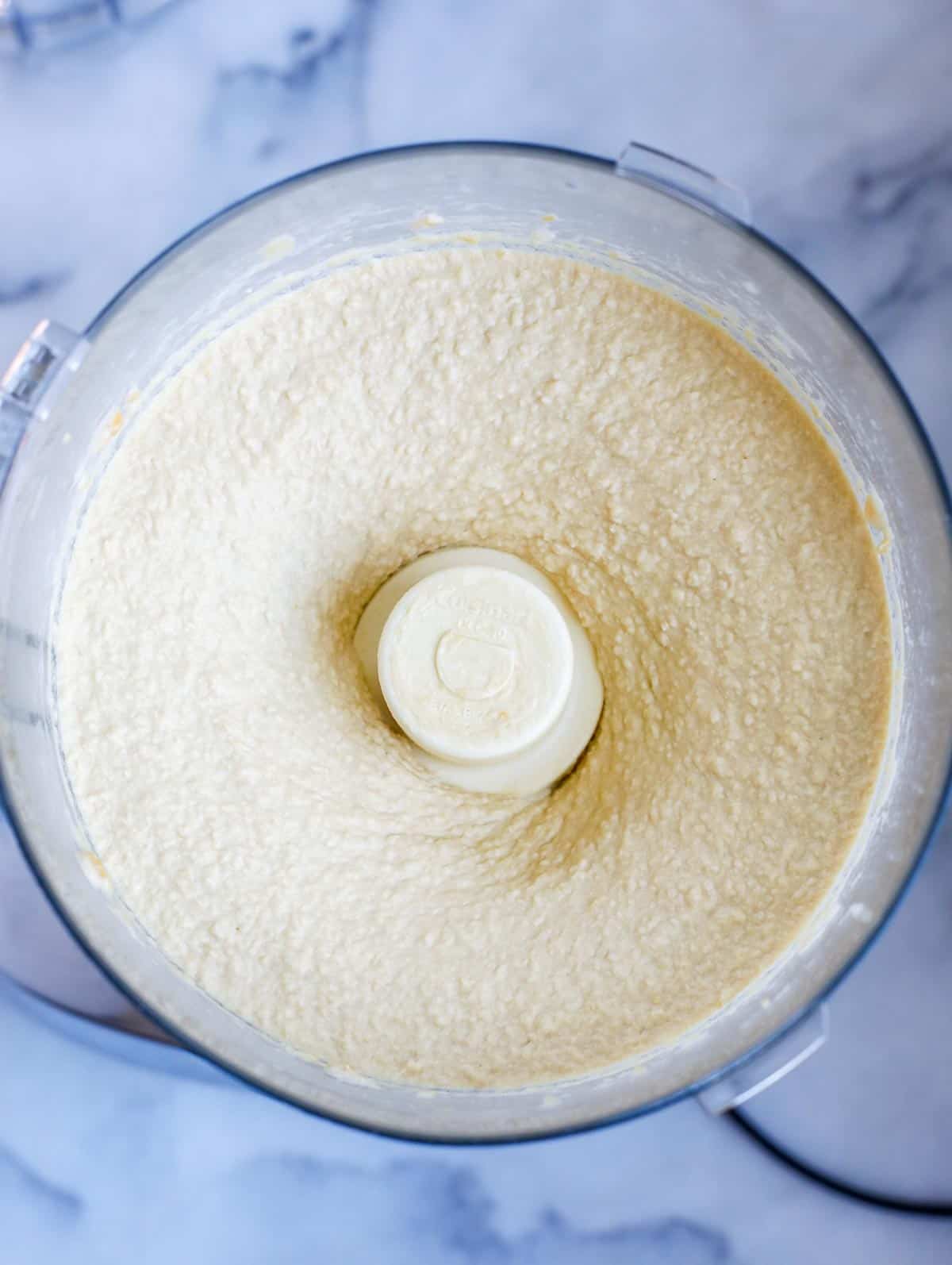 pureed hummus in a food processor