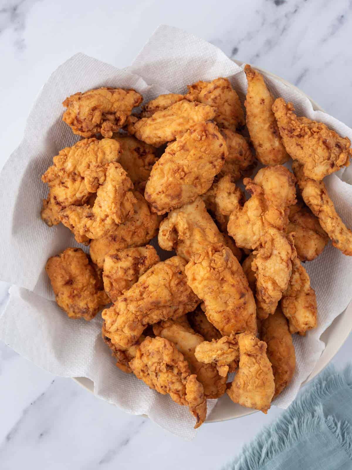 A bowl of fried chicken tenders.