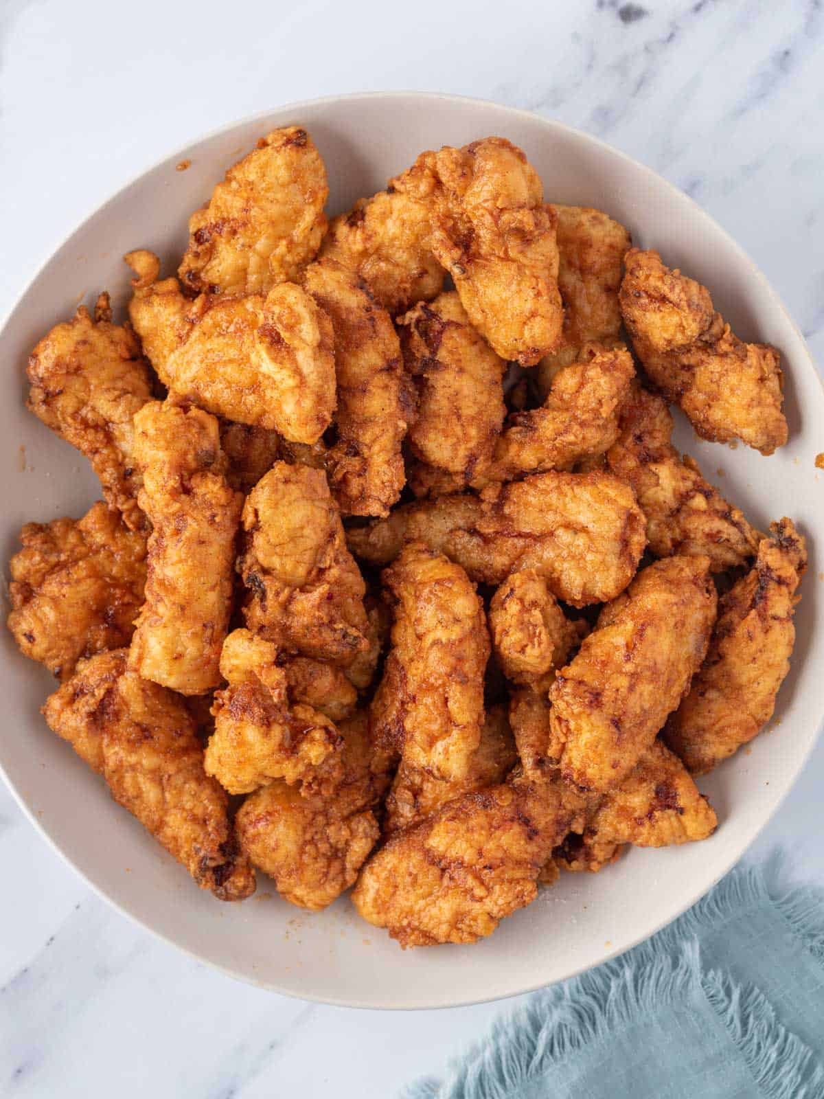 A bowl of Nashville hot chicken tenders