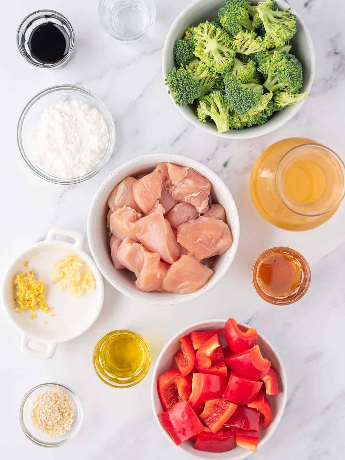 Bowls with ingredients for easy chicken teriyaki stir fry.