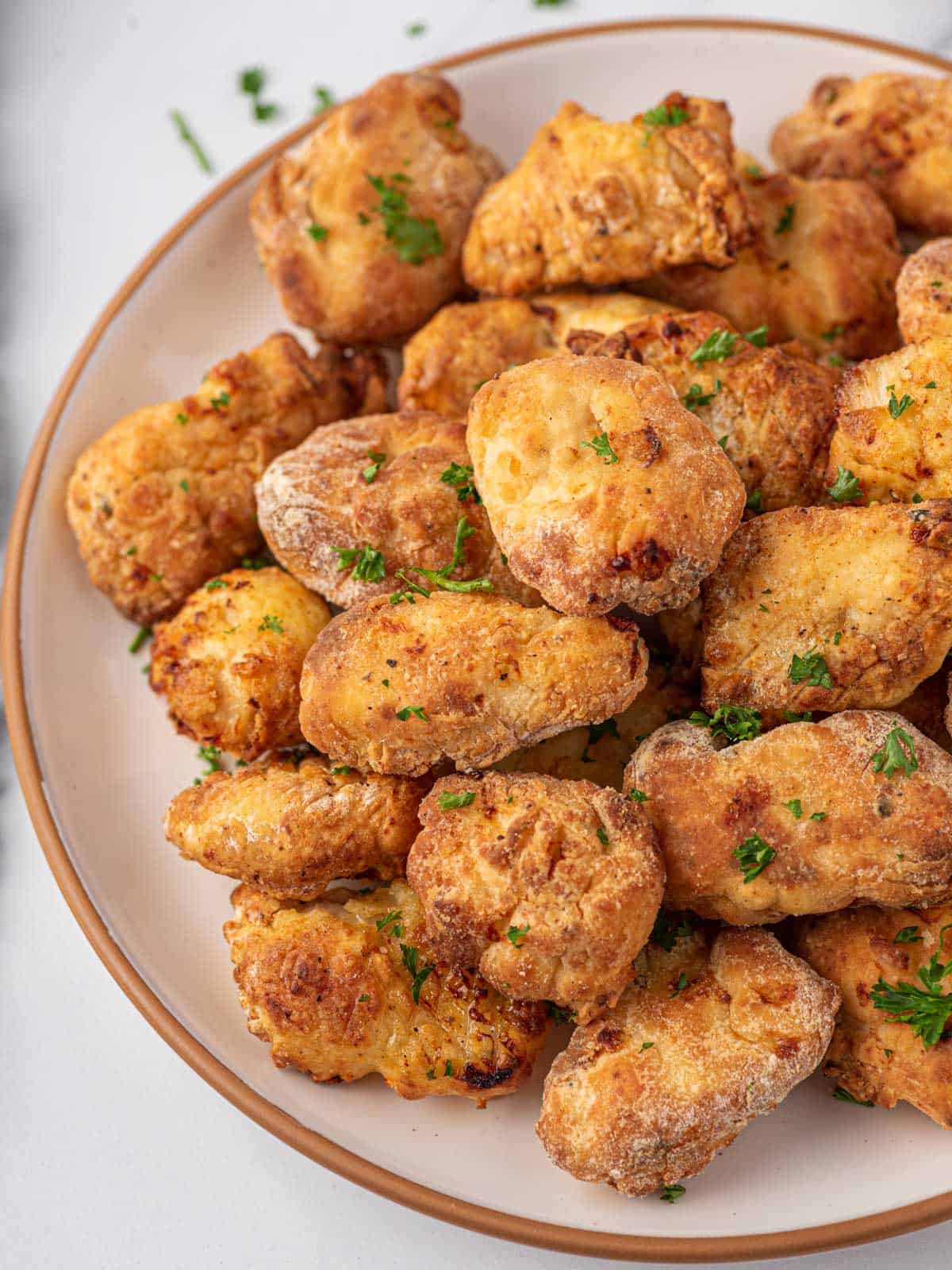 Air fryer popcorn chicken in a bowl.