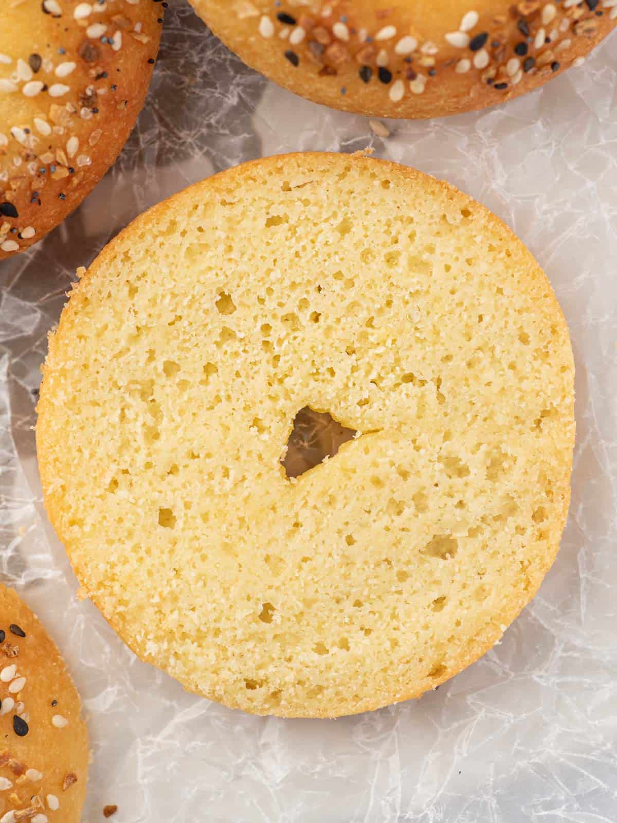 Closeup of low carb everything bagel sliced in half.