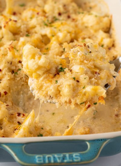 A scoop of cheese cauliflower mac and cheese.