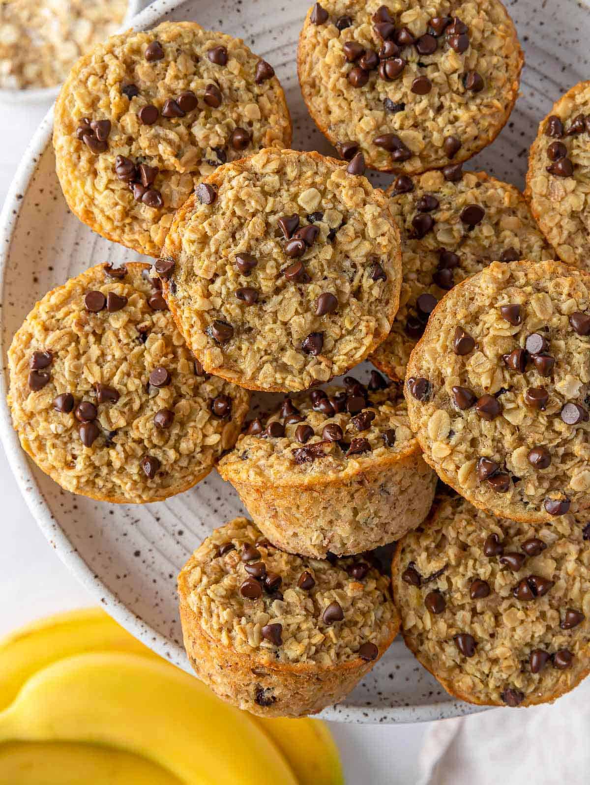 Overhead view of a plate of baked banana oatmeal cups.