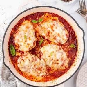 Overhead view of a pan with chicken parmesan.