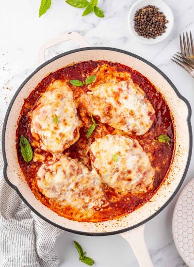 Overhead view of a pan with chicken parmesan.