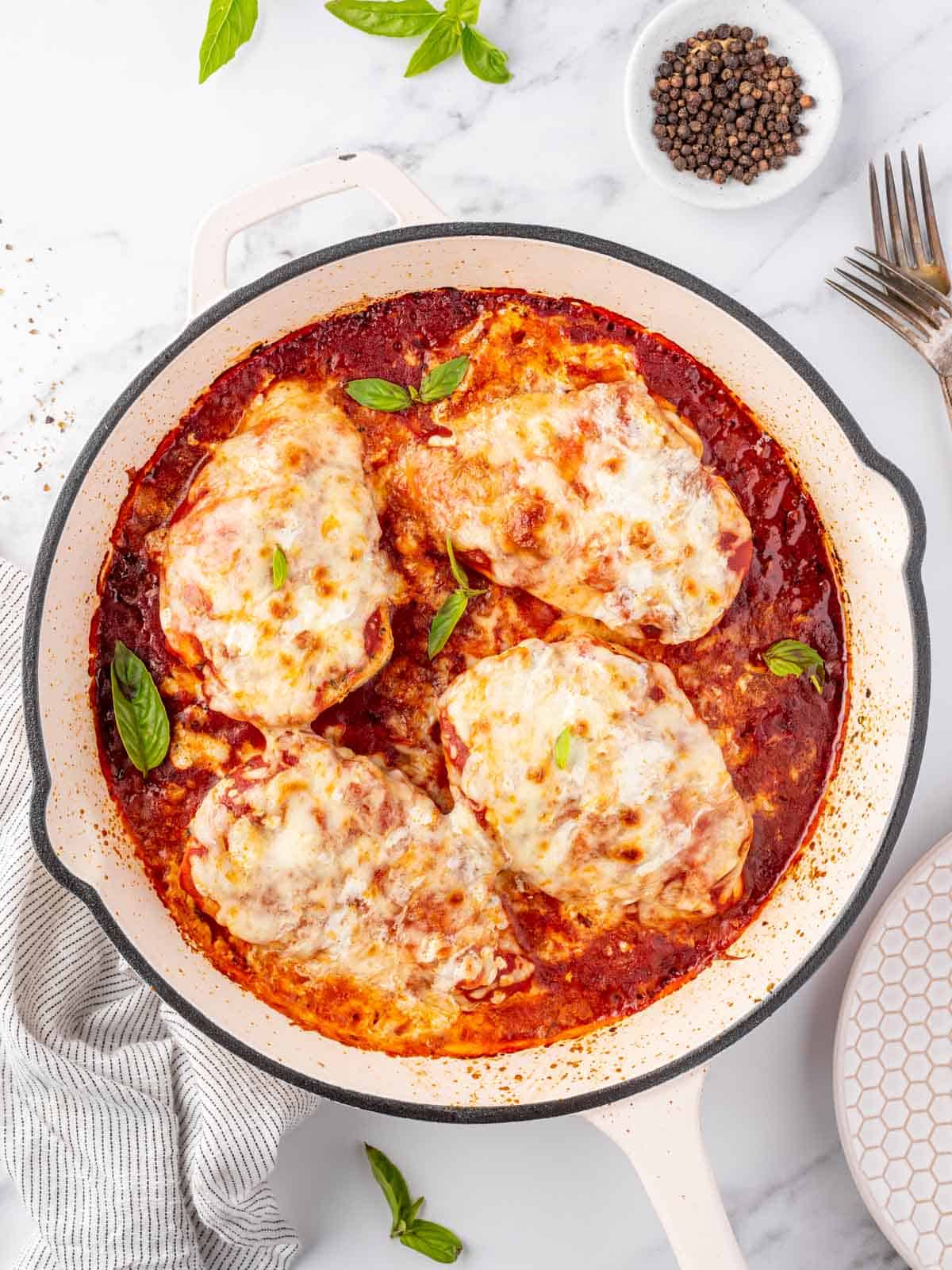 Overhead view of a pan with chicken parmesan.