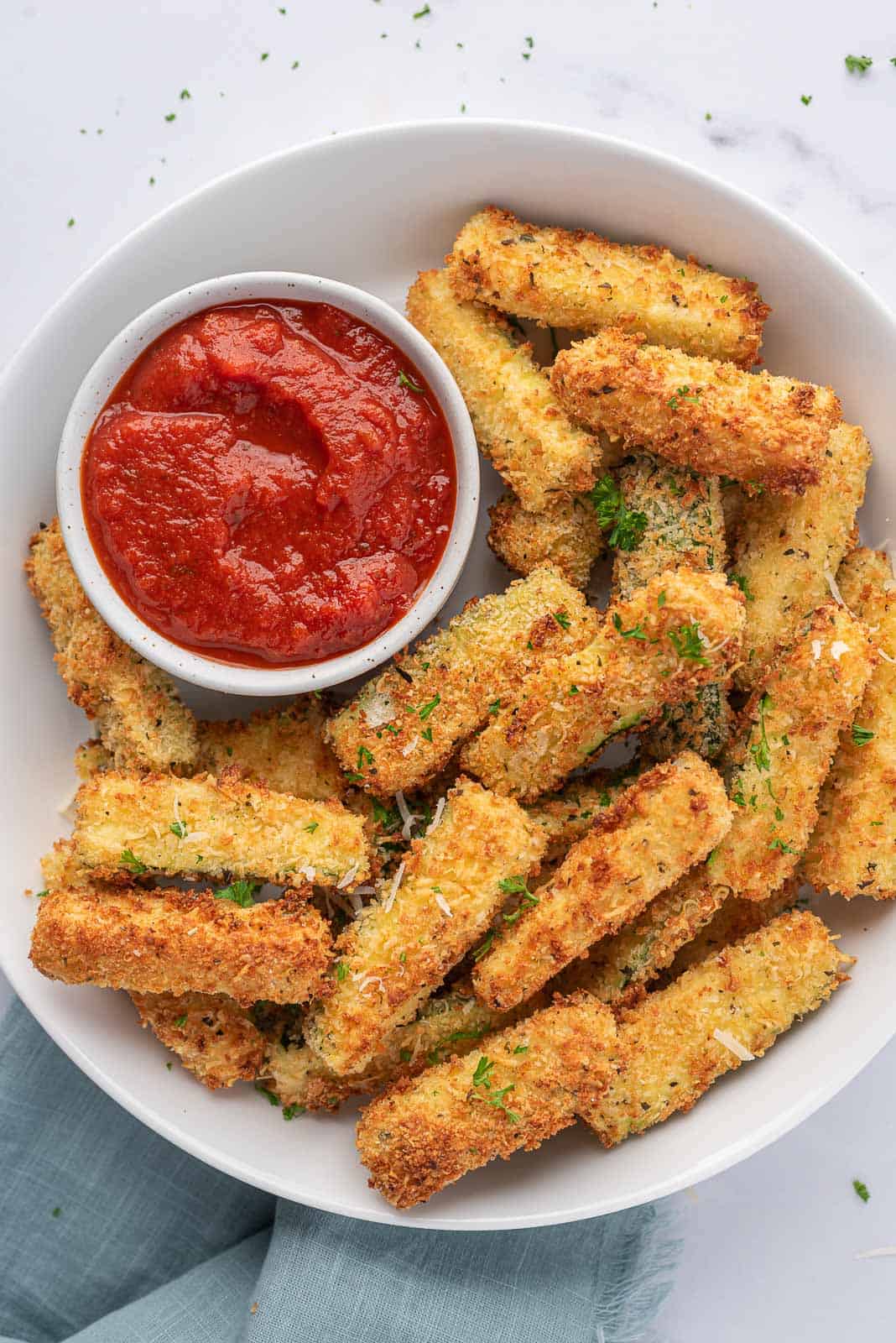 A platter of crispy zucchini sticks.