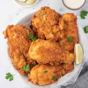 Extra crispy fried chicken on a serving plate.