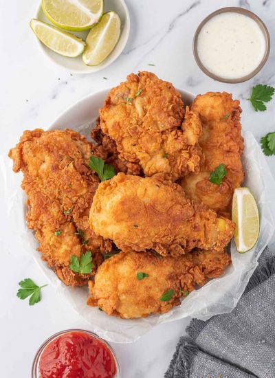 Extra crispy fried chicken on a serving plate.