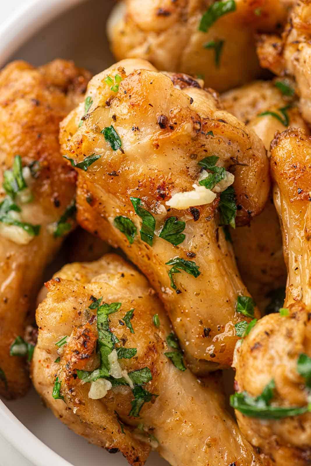 Close up photo of garlic chicken wings.