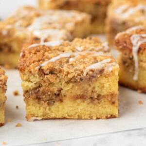 Squares of keto coffee cake on parchment paper.