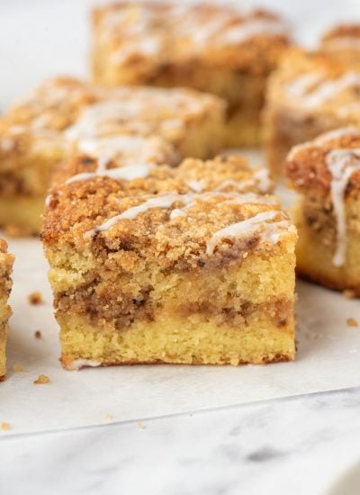 Squares of keto coffee cake on parchment paper.