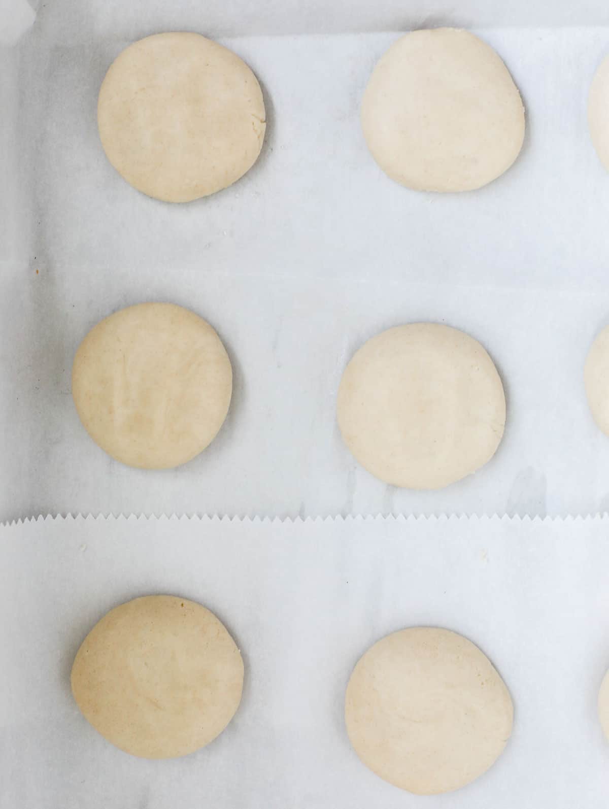 ghraybeh cookies in a sheet pan before finger indent