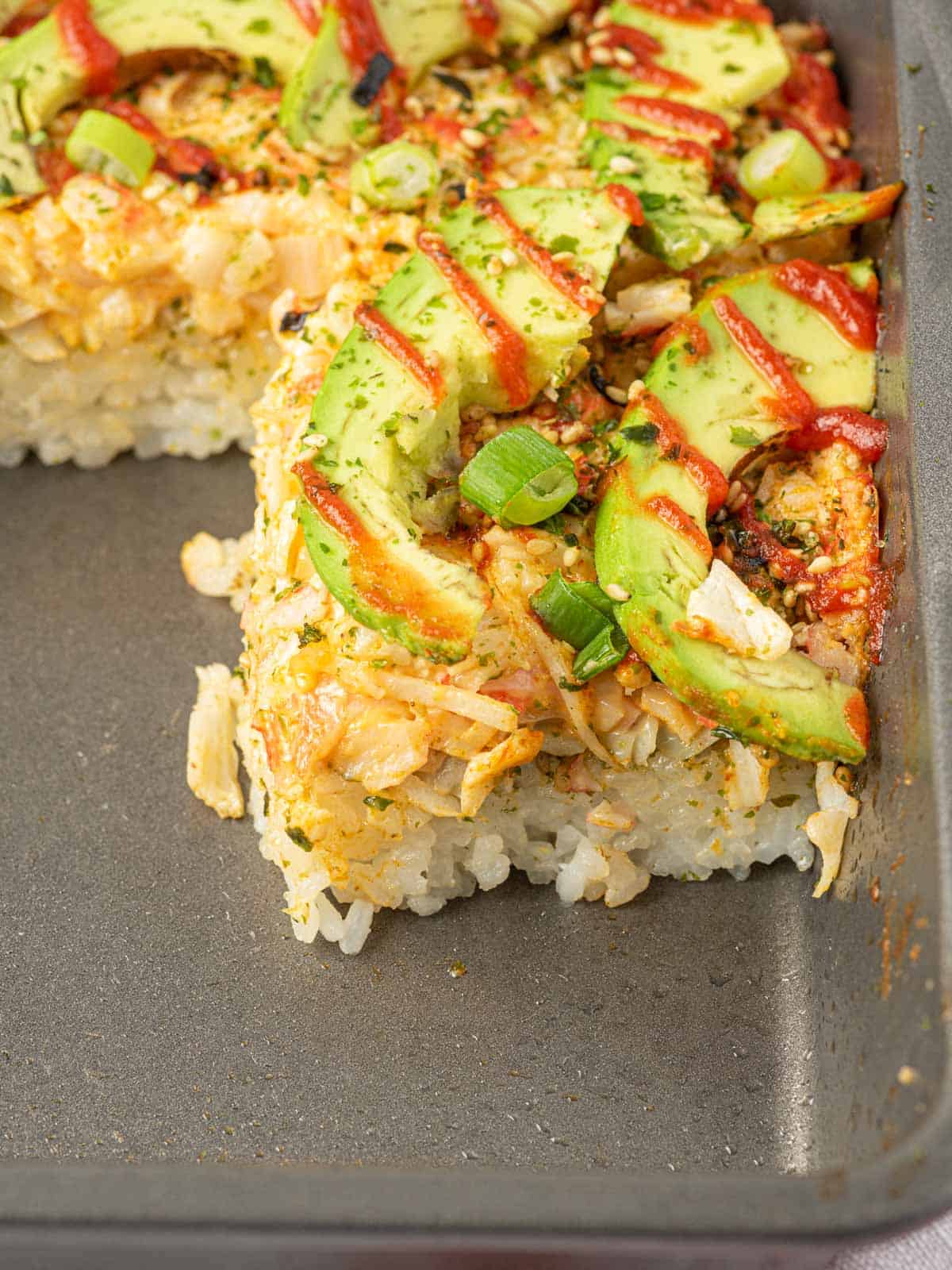 Imitation crab sushi bake in a casserole dish.