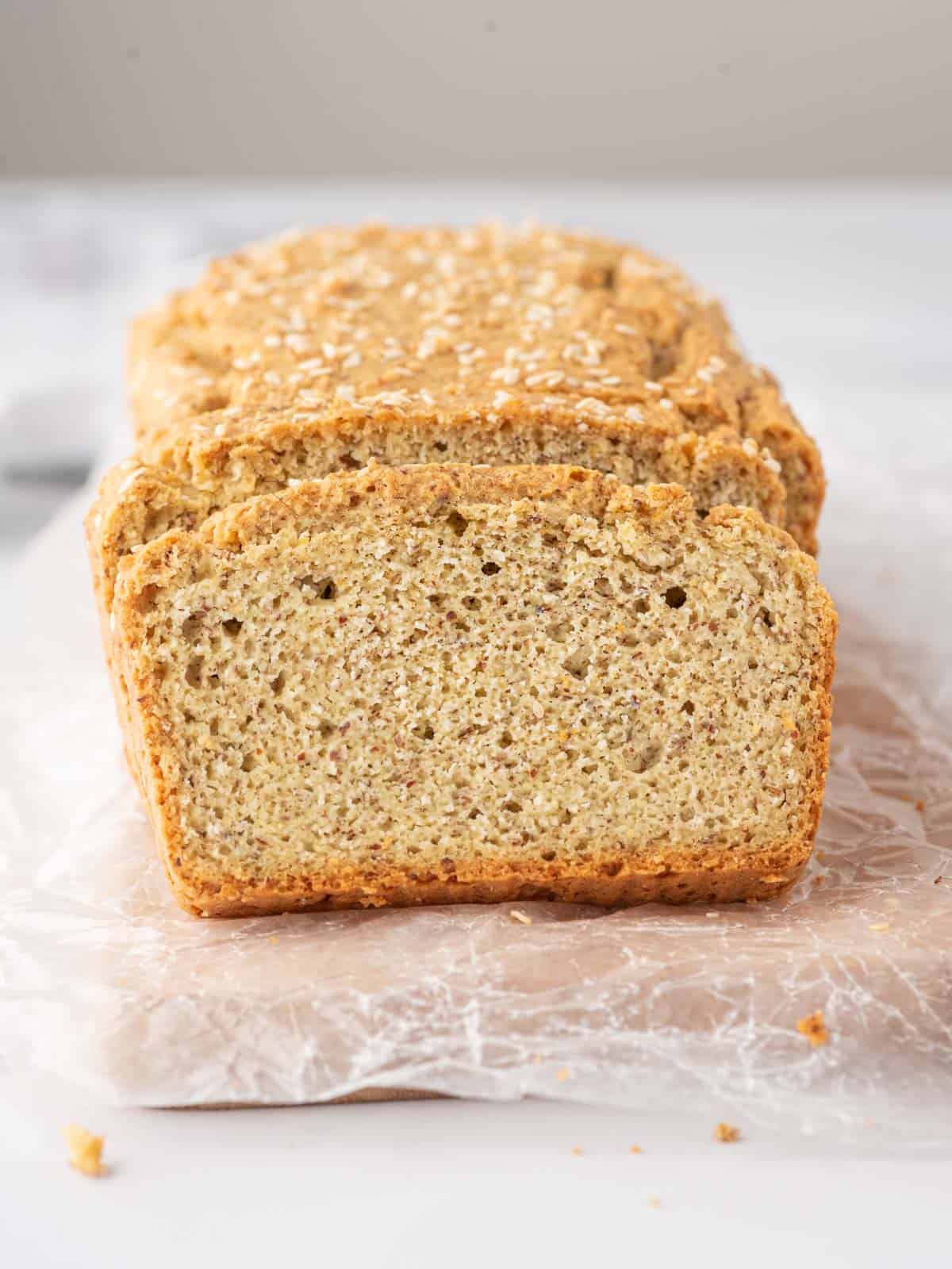 Close up of keto sandwich bread loaf and slice.