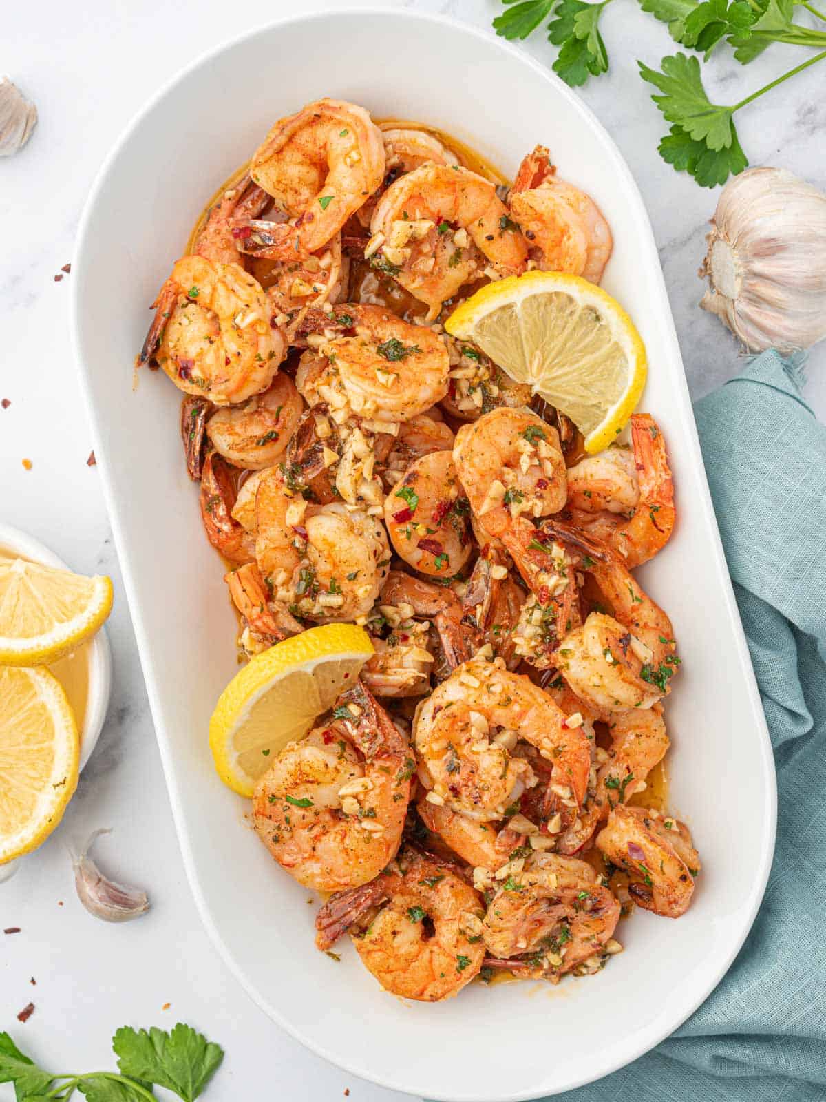 A large tray of garlic and lemon shrimp.
