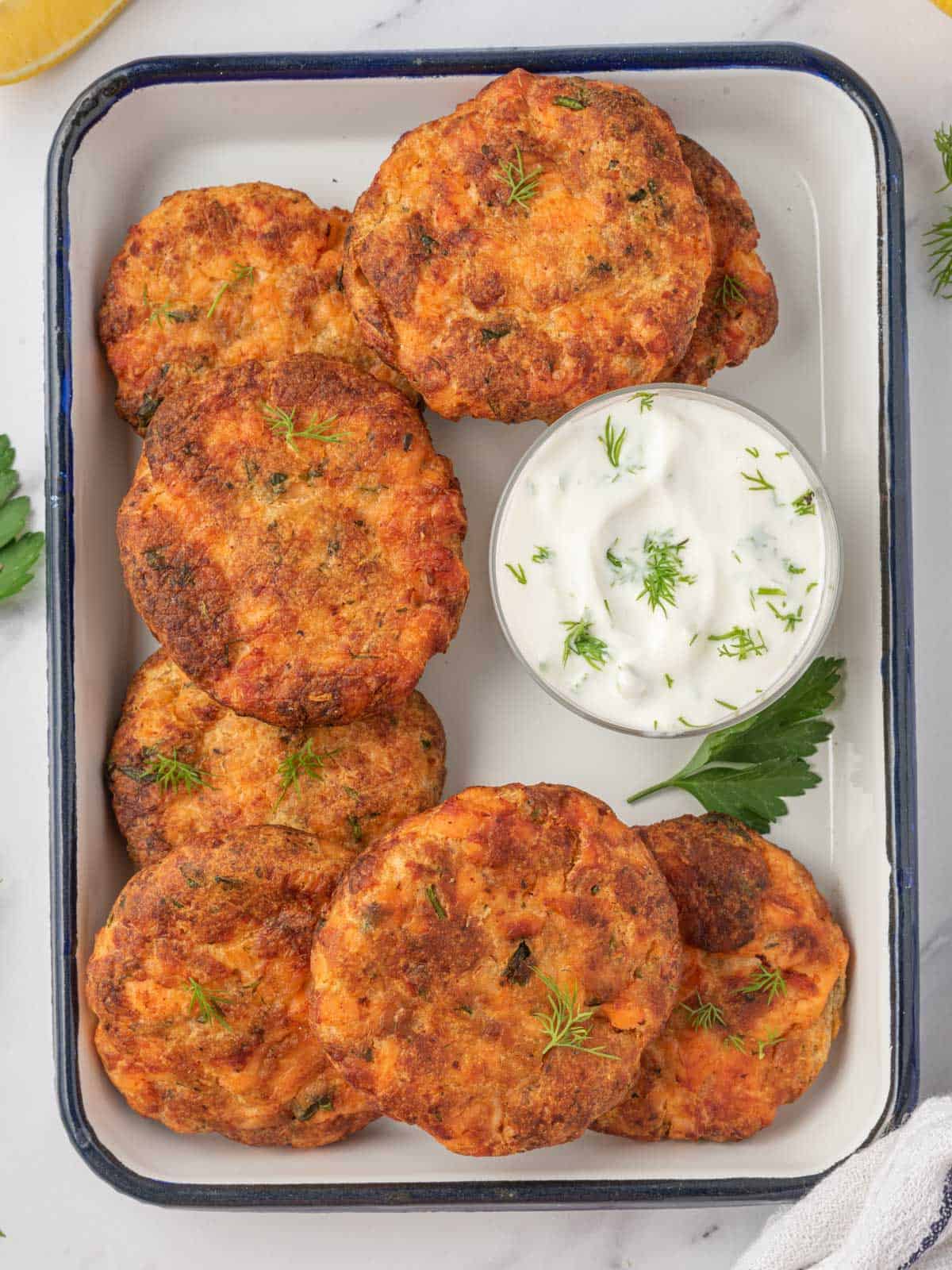Fresh salmon patties recipe on a tray for serving.