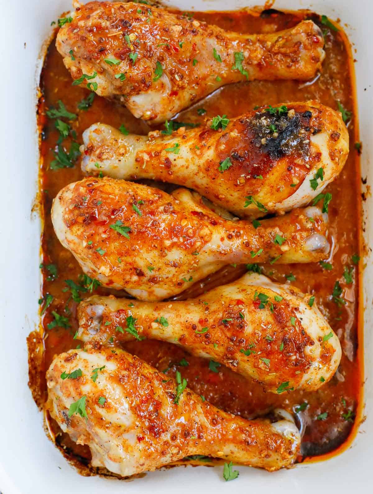 Finished easy chicken drumsticks recipe on a platter for serving.