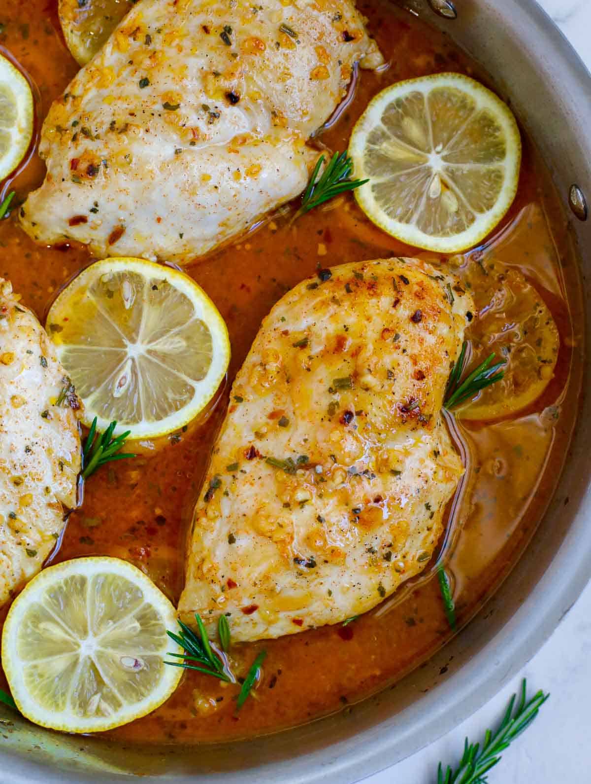 Closeup of lemon rosemary chicken skillet.