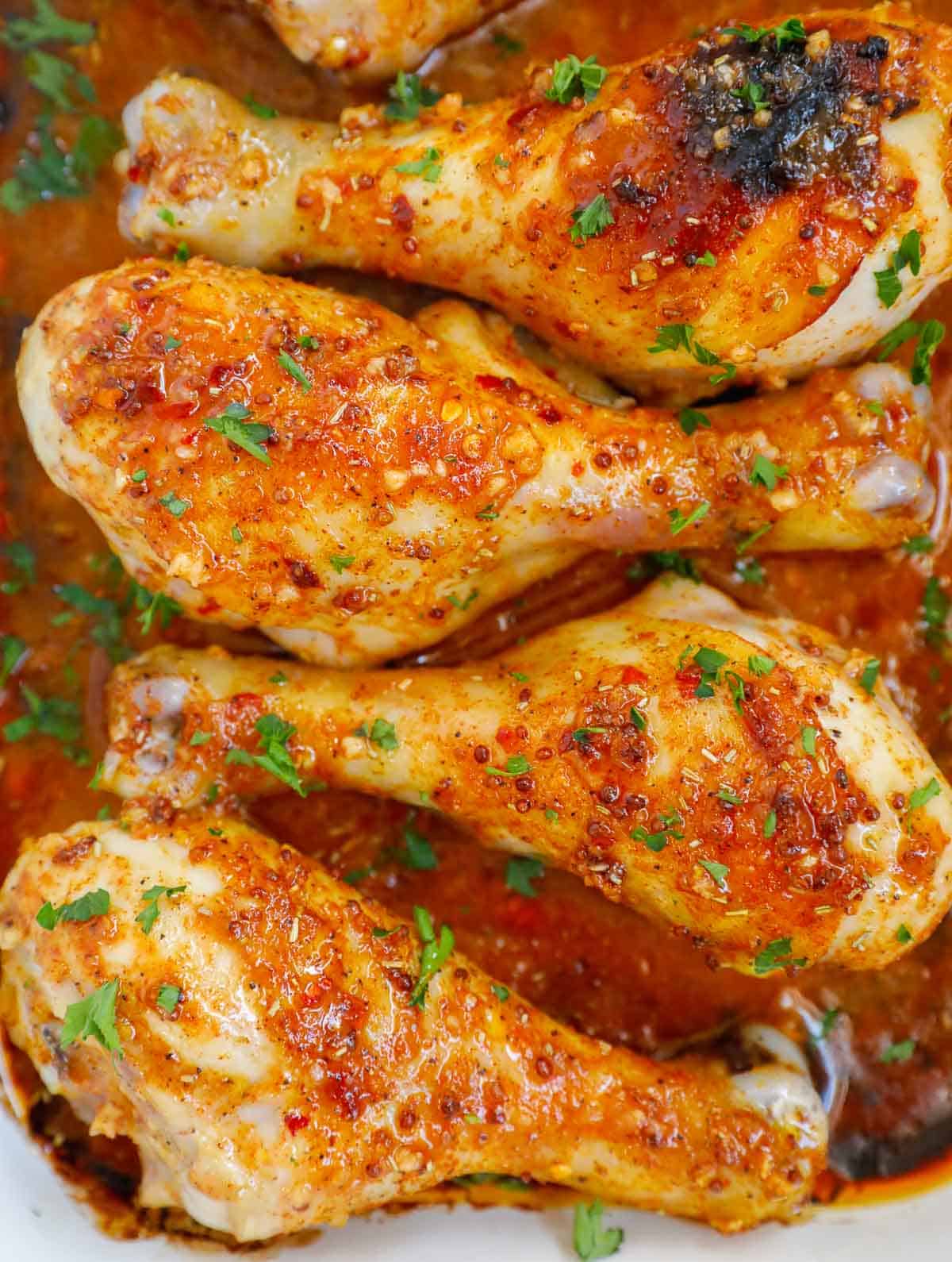 Honey mustard chicken legs in a platter.