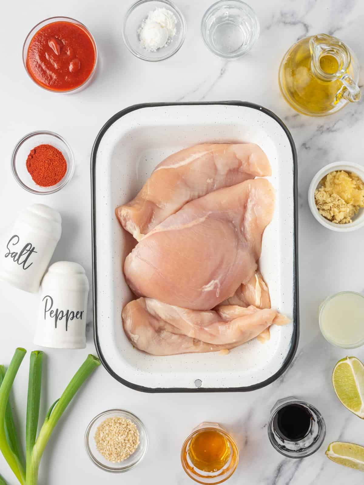 Ingredients needed for honey sriracha baked chicken breast.