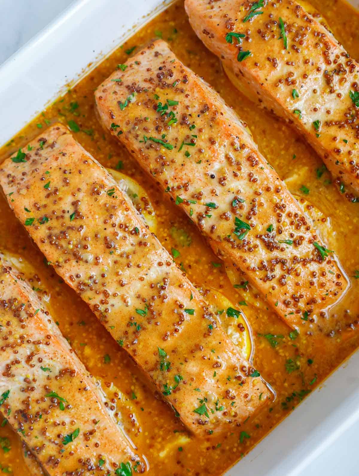 Honey mustard salmon recipe on a baking dish.
