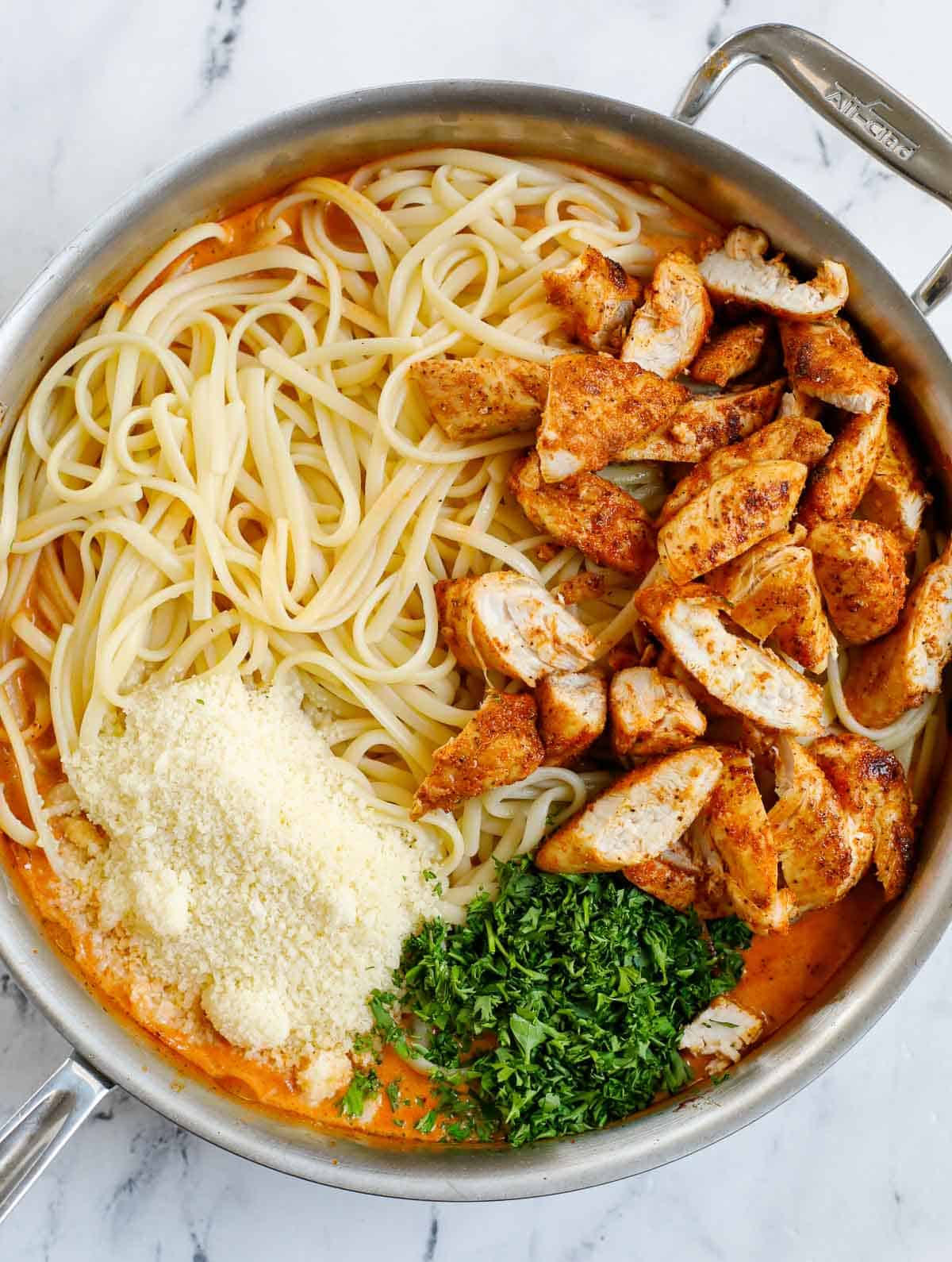 Combine pasta and chicken with spicy pasta sauce.