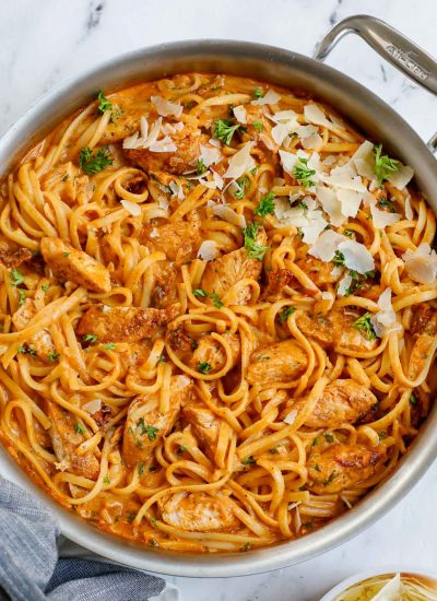 A skillet of chicken and spicy pasta sauce.