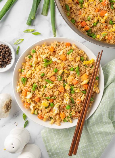 A bowl of the best Chinese fried rice with chopsticks.