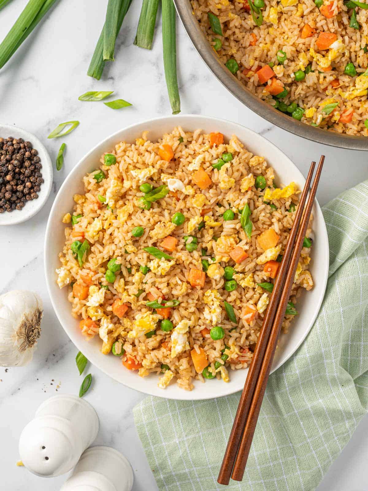 A bowl of the best Chinese fried rice with chopsticks.