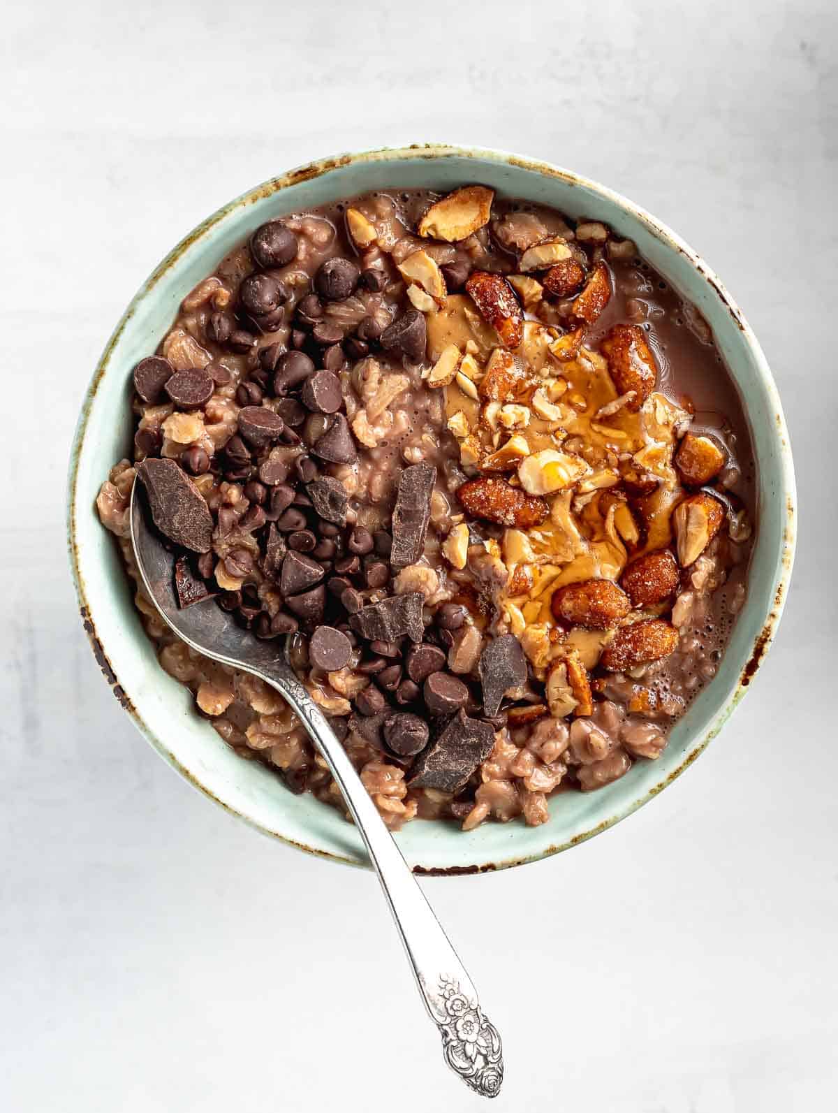 chocolate oatmeal in a bowl with toppings